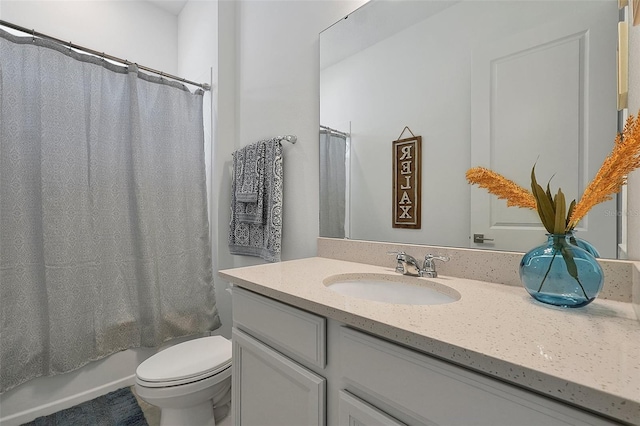 full bathroom with vanity, toilet, and shower / bath combo with shower curtain