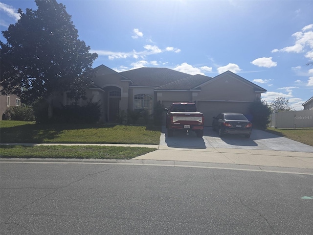 view of front facade with a garage and a front yard