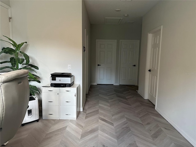 hallway featuring light parquet flooring