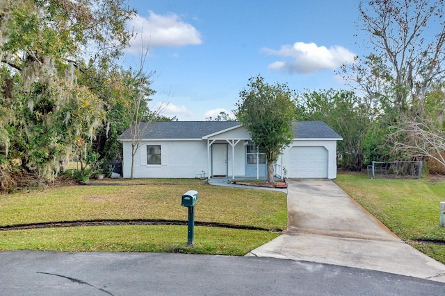 single story home featuring a garage and a front yard