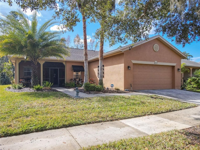 ranch-style home with a garage and a front lawn