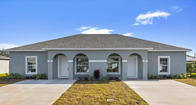 ranch-style home featuring a front yard