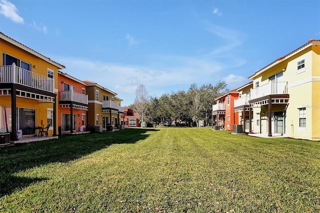 view of yard with central air condition unit