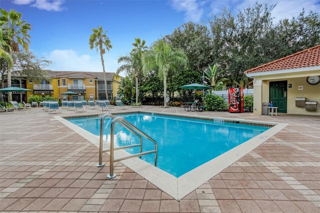 view of swimming pool with a patio area