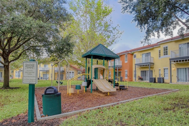 view of play area featuring cooling unit and a yard