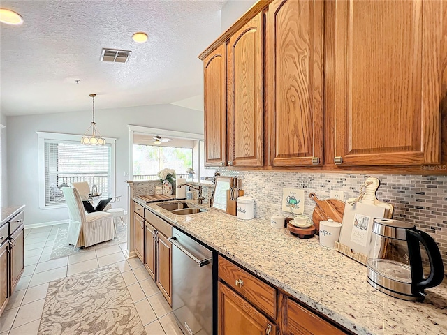 kitchen with lofted ceiling, sink, light stone countertops, and dishwasher