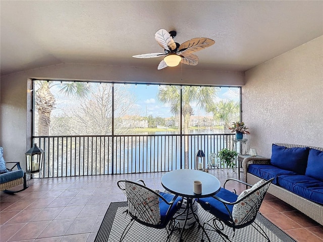 sunroom / solarium with vaulted ceiling and ceiling fan