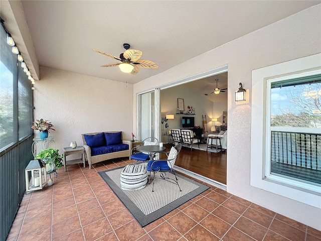 sunroom / solarium with ceiling fan