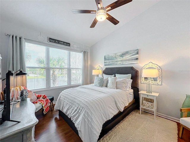 bedroom featuring ceiling fan, vaulted ceiling, and hardwood / wood-style floors