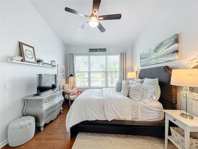 bedroom with vaulted ceiling, wood-type flooring, and ceiling fan