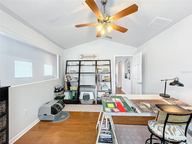 home office featuring hardwood / wood-style flooring, ceiling fan, and lofted ceiling