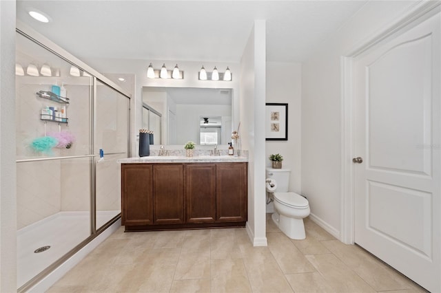 bathroom with walk in shower, tile patterned floors, vanity, and toilet