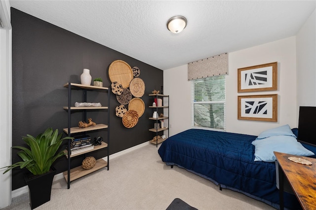 carpeted bedroom with a textured ceiling