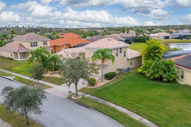 birds eye view of property with a water view