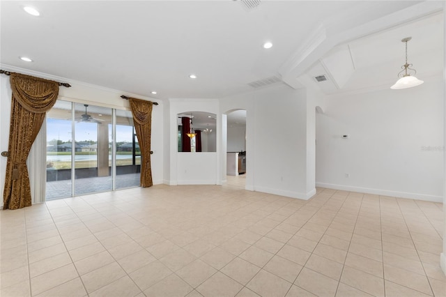 empty room with light tile patterned floors and ornamental molding