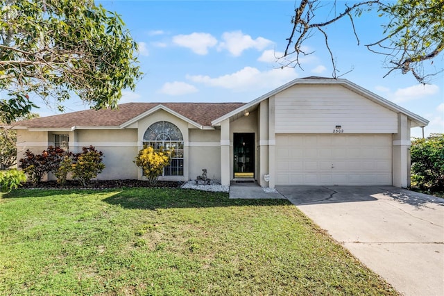 ranch-style home featuring a garage and a front yard