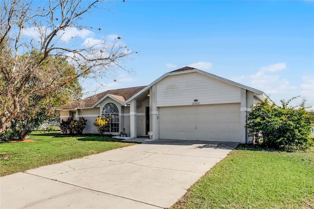 ranch-style house with a garage and a front yard