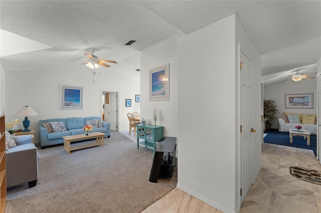 living room with vaulted ceiling, light carpet, a textured ceiling, and ceiling fan