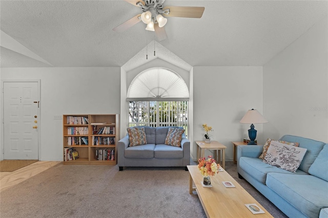 carpeted living room with ceiling fan, lofted ceiling, and a textured ceiling