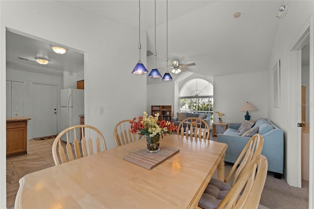 dining room featuring light tile patterned flooring and ceiling fan