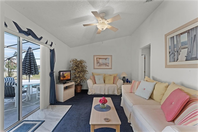 carpeted living room featuring vaulted ceiling, ceiling fan, and a textured ceiling