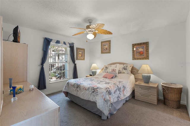 carpeted bedroom with a textured ceiling and ceiling fan