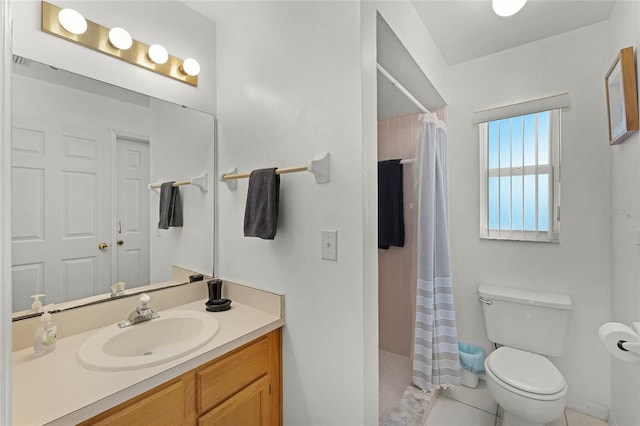 bathroom featuring vanity, toilet, tile patterned flooring, and a shower with shower curtain