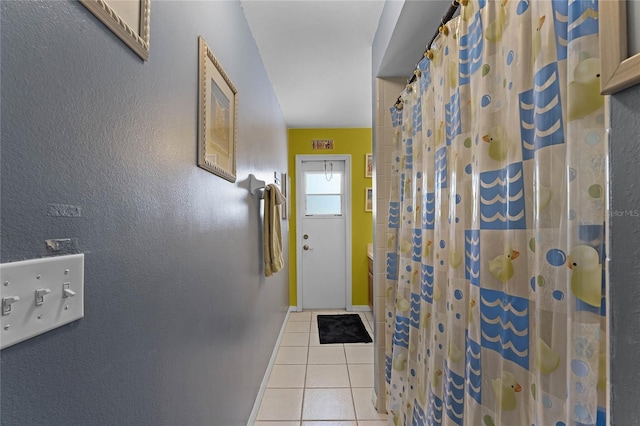 entryway with light tile patterned floors