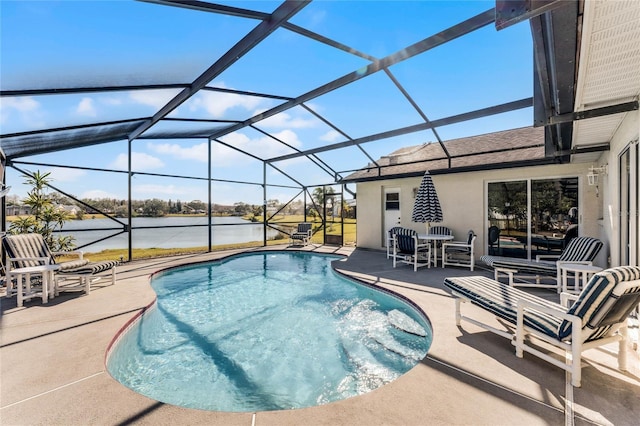 view of pool with a water view, a patio, and glass enclosure