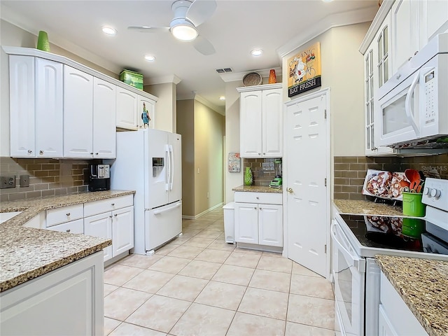 kitchen with light tile patterned floors, white appliances, ornamental molding, white cabinets, and decorative backsplash