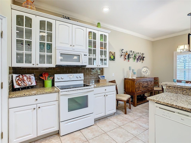 kitchen with crown molding, light stone counters, white appliances, decorative backsplash, and white cabinets