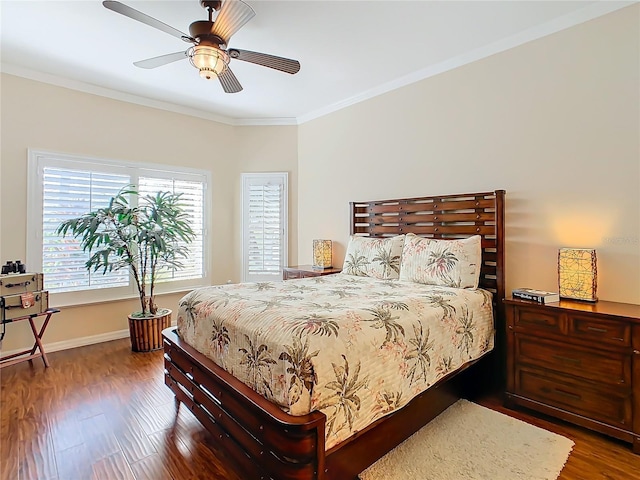 bedroom featuring crown molding, dark wood-type flooring, and ceiling fan