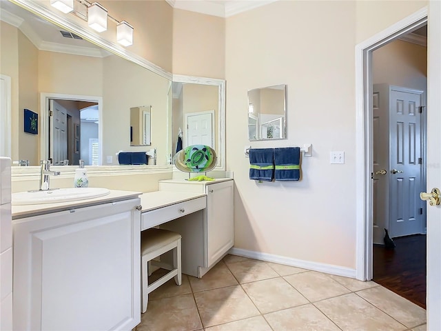 bathroom with crown molding, tile patterned floors, and vanity