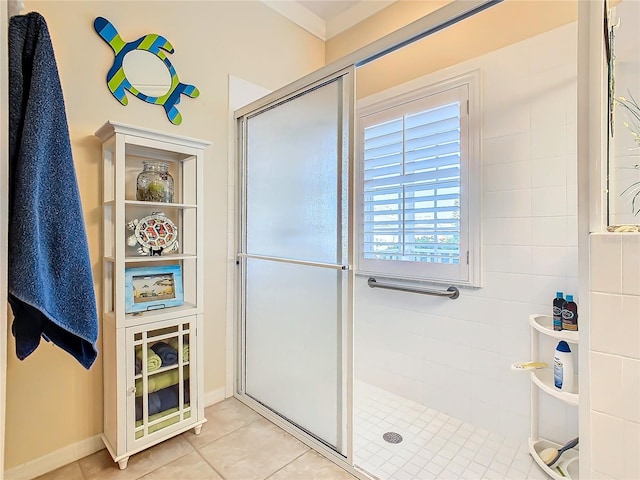 bathroom with tile patterned floors and walk in shower