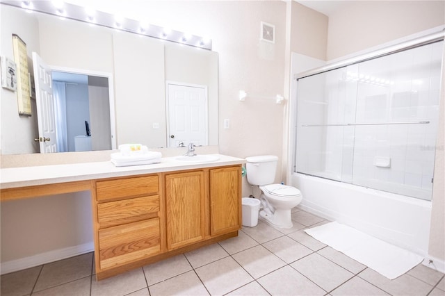 full bathroom featuring tile patterned floors, vanity, toilet, and combined bath / shower with glass door