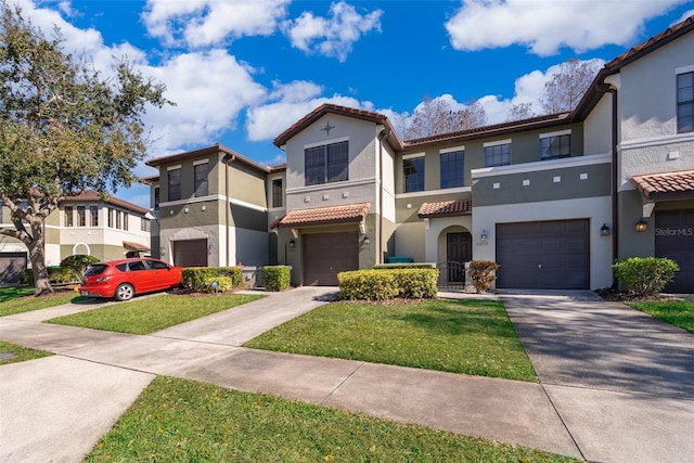 view of front of house with a garage and a front lawn