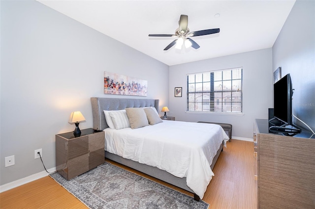 bedroom featuring hardwood / wood-style flooring and ceiling fan