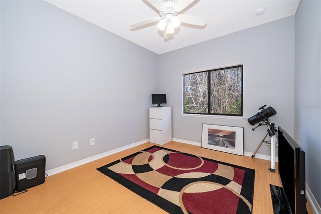 interior space featuring ceiling fan and wood-type flooring