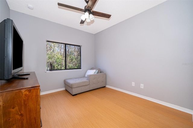 unfurnished room with ceiling fan and light hardwood / wood-style floors