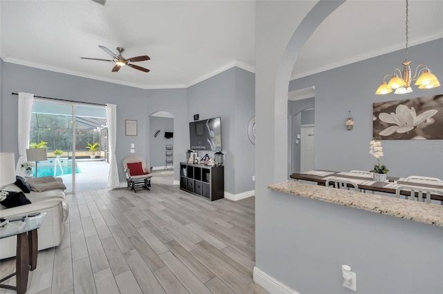 living room featuring ornamental molding, ceiling fan with notable chandelier, and light hardwood / wood-style flooring