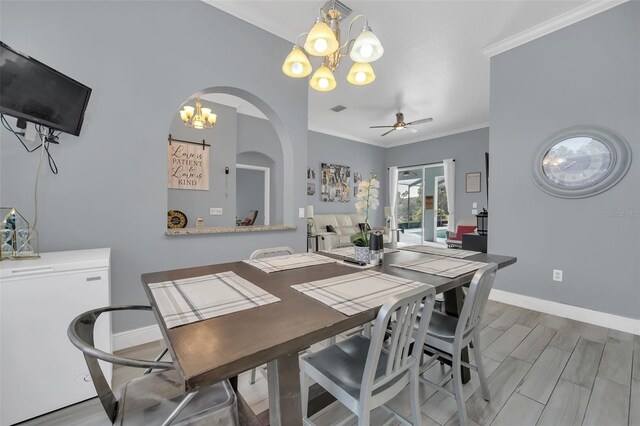 dining room with ceiling fan, ornamental molding, and light wood-type flooring