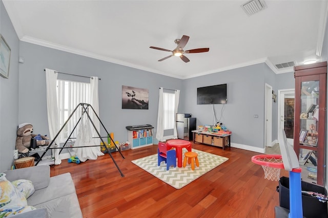 rec room featuring crown molding, hardwood / wood-style floors, and ceiling fan