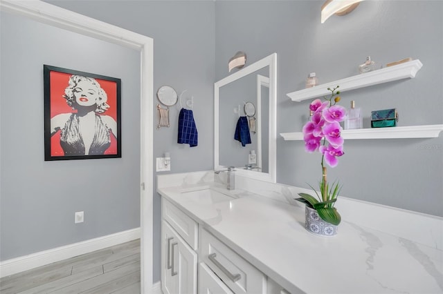 bathroom featuring vanity and wood-type flooring