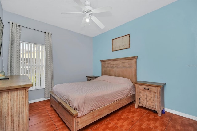 tiled bedroom with ceiling fan