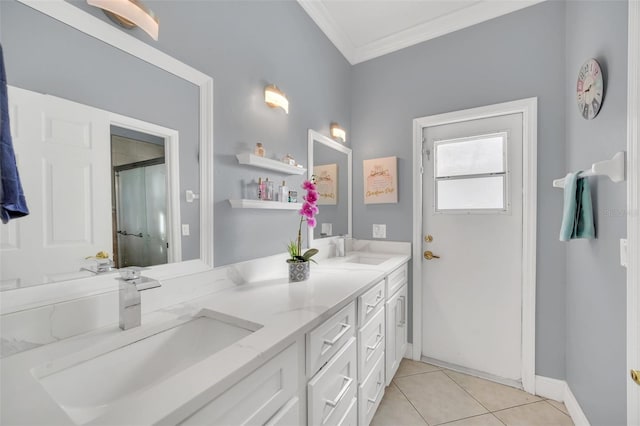 bathroom with crown molding, tile patterned floors, and vanity