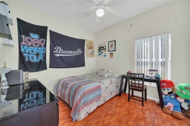 bedroom with tile patterned flooring and ceiling fan