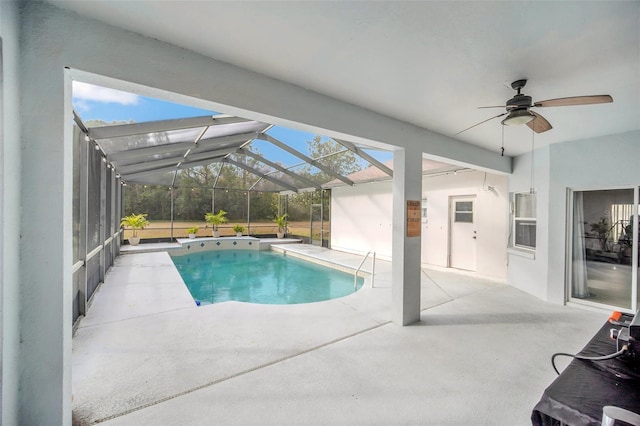 view of swimming pool featuring a lanai, a patio area, and ceiling fan