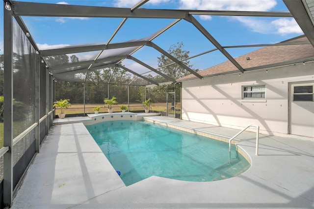 view of swimming pool with a lanai and a patio area