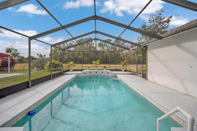 view of pool with a patio, glass enclosure, and a lawn