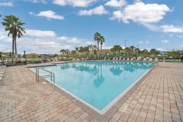 view of swimming pool with a patio